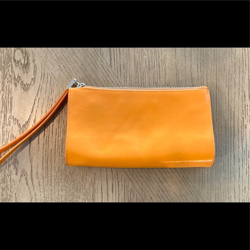 NWOT Monsac leather orange wristlet. Sz 8x5